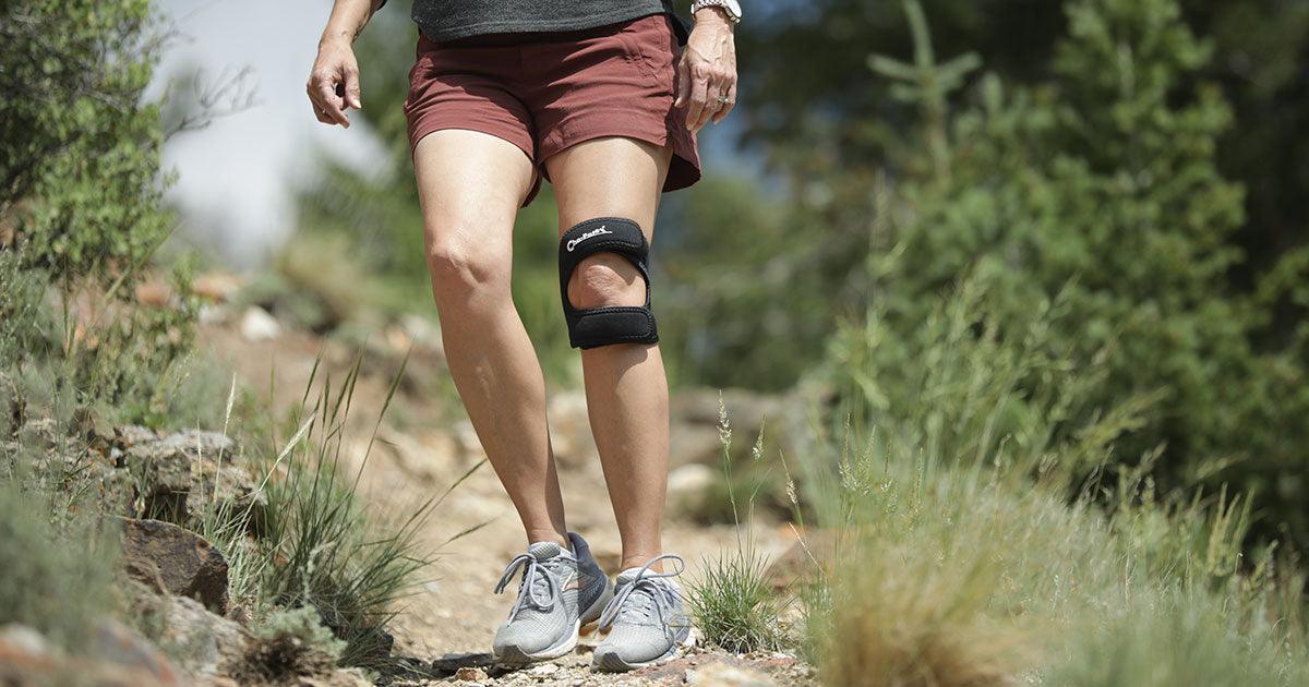 Runner wearing Cho-Pat Dual Action Knee Strap