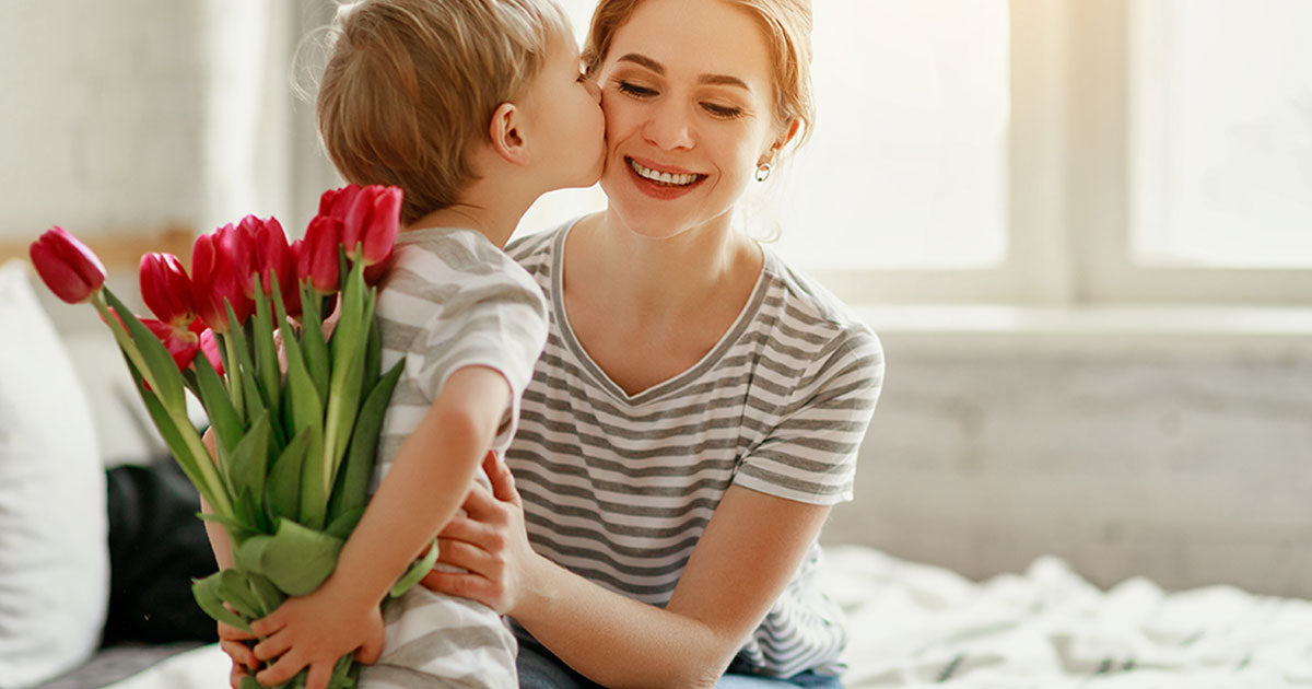 a mother receiving a gift from son