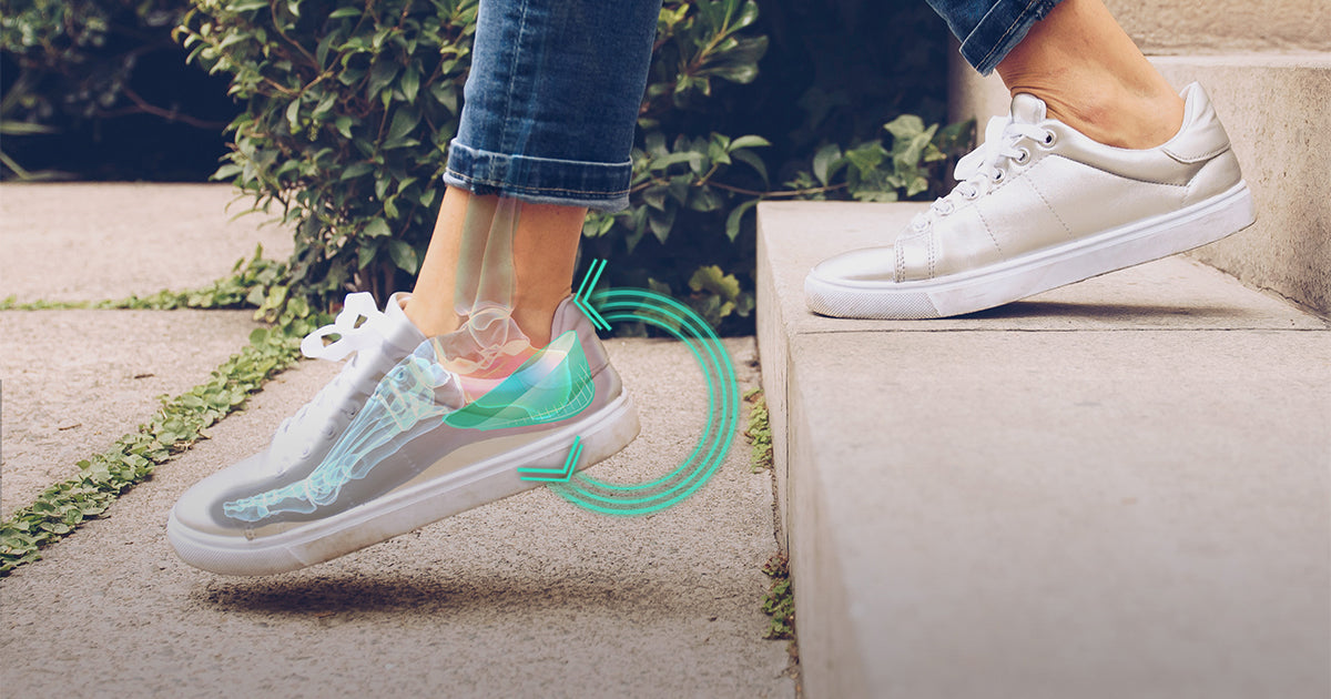 Person stepping down stairs showing heel impact and arch support with cushioned heel absorbing shock in shoe