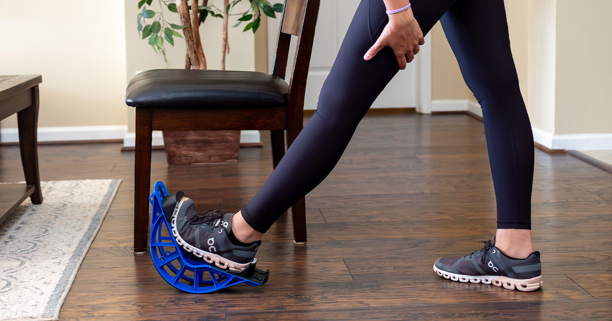 lady stretching tight calves using ProStretch Plus