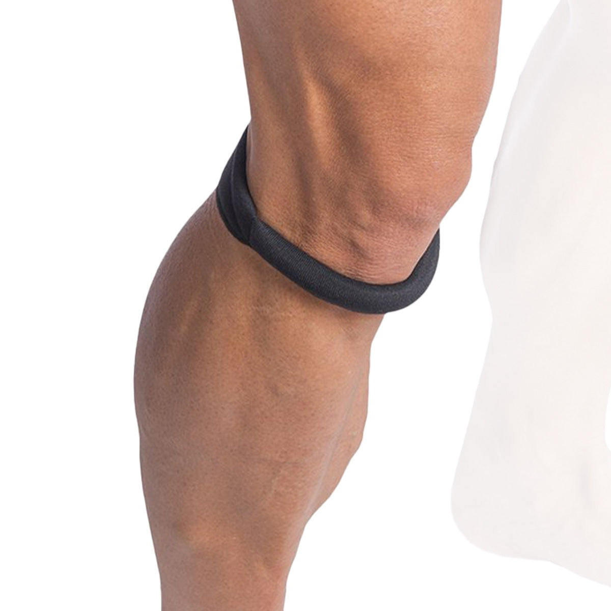 Cho-Pat Original Knee Strap on a person's knee against a white background