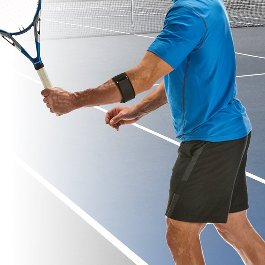 Cho-Pat Tennis Elbow Support on a  woman holding a tennis raquet