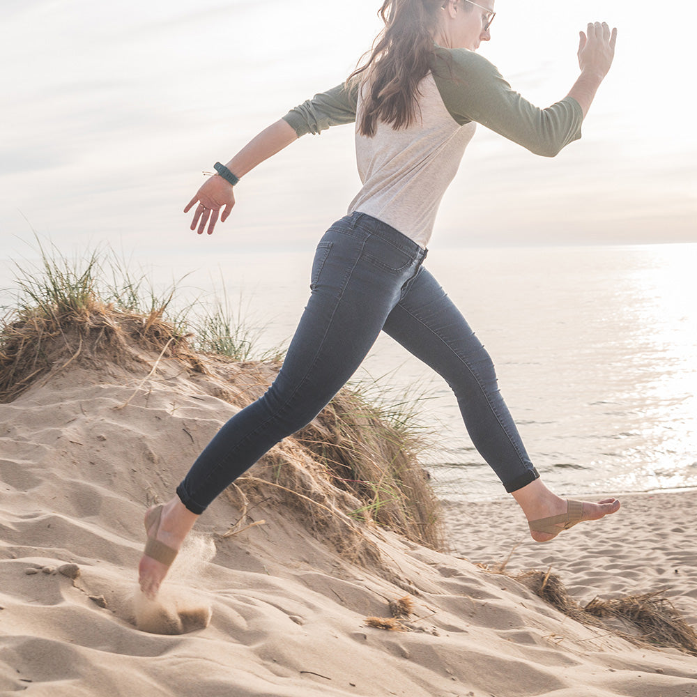 Lady at the beach wearing The X Brace PLUS
