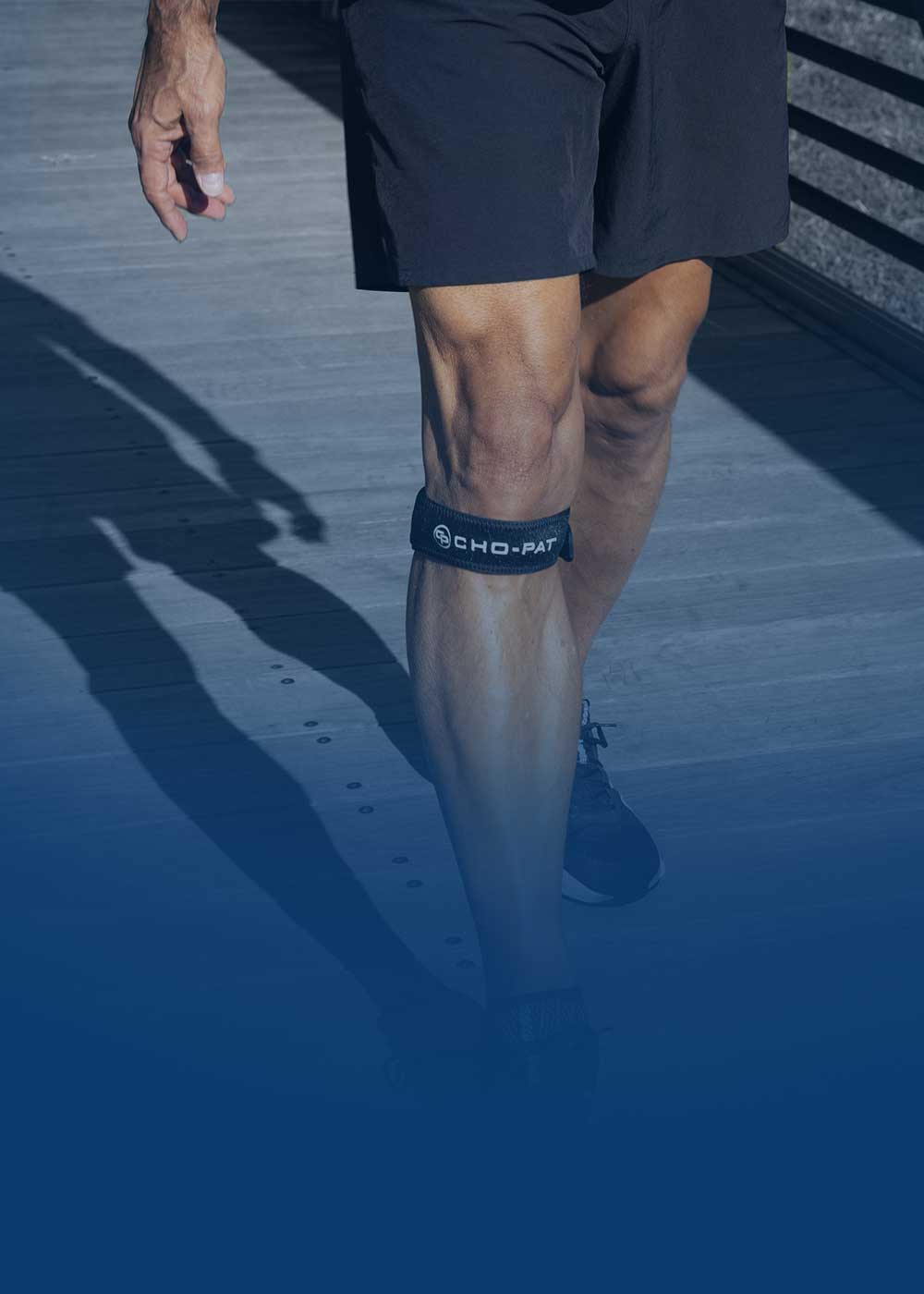 Runner wearing a Cho-Pat knee strap below the kneecap for targeted support