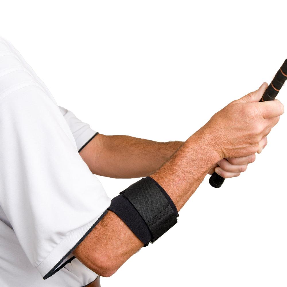 Man holding golf club wearing the Cho-Pat Golfer's Elbow Support
