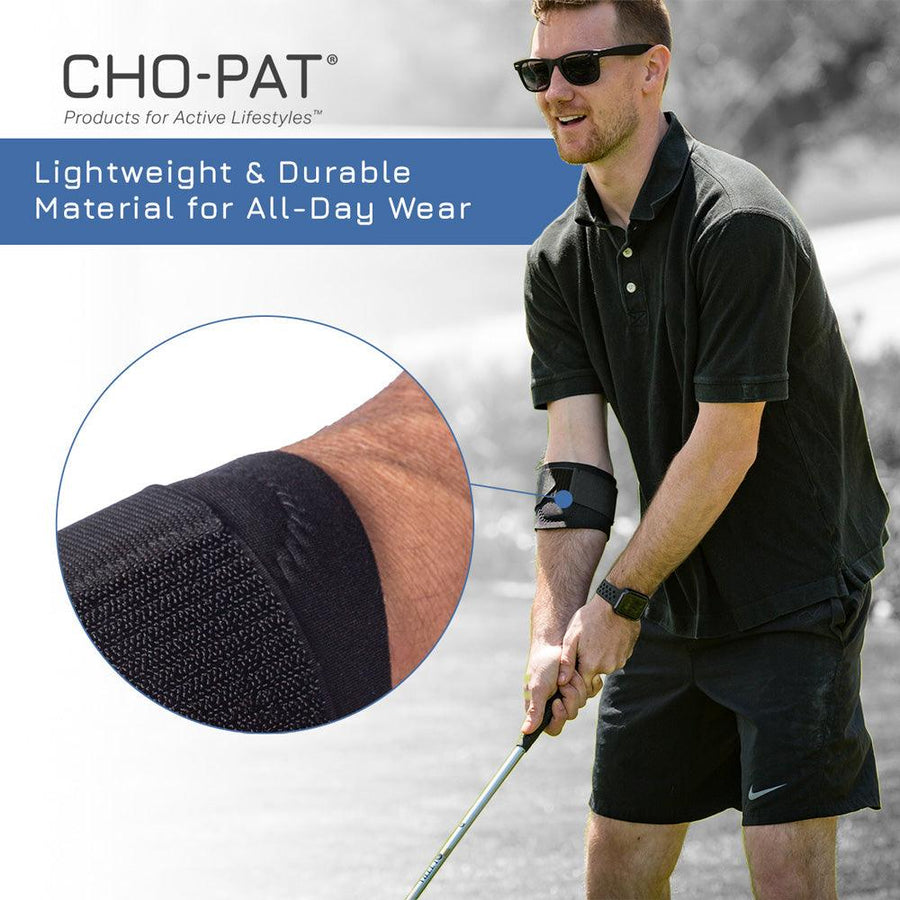 Man holding golf club wearing the Cho-Pat Golfer's Elbow Support