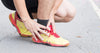 male runner suffering from Achilles tendonitis pain