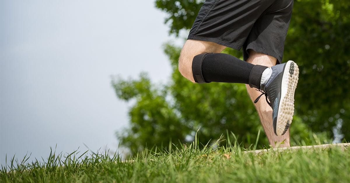 Runner wearing the Cho-Pat Shin Splint and Calf Compression Sleeve