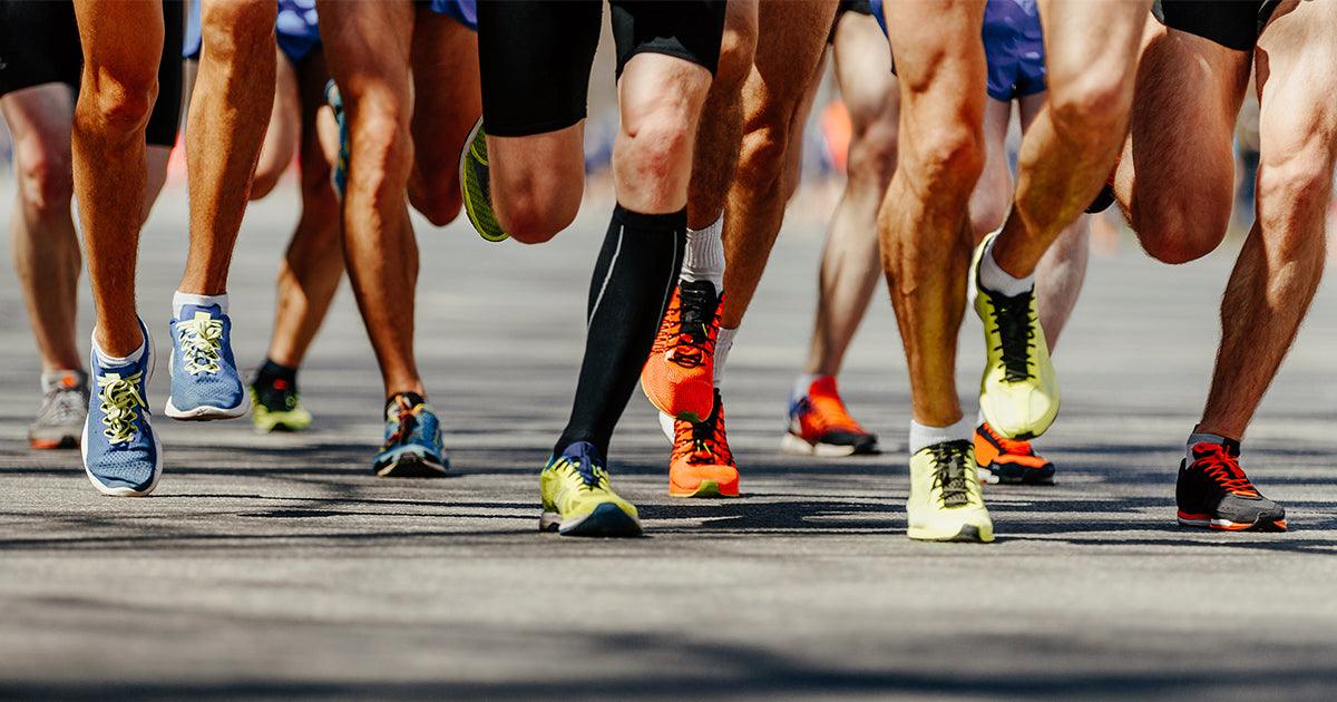 group of runners only showing leg