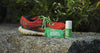 Tennis shoes on rock next to 2Toms SportShield anti chafing products.