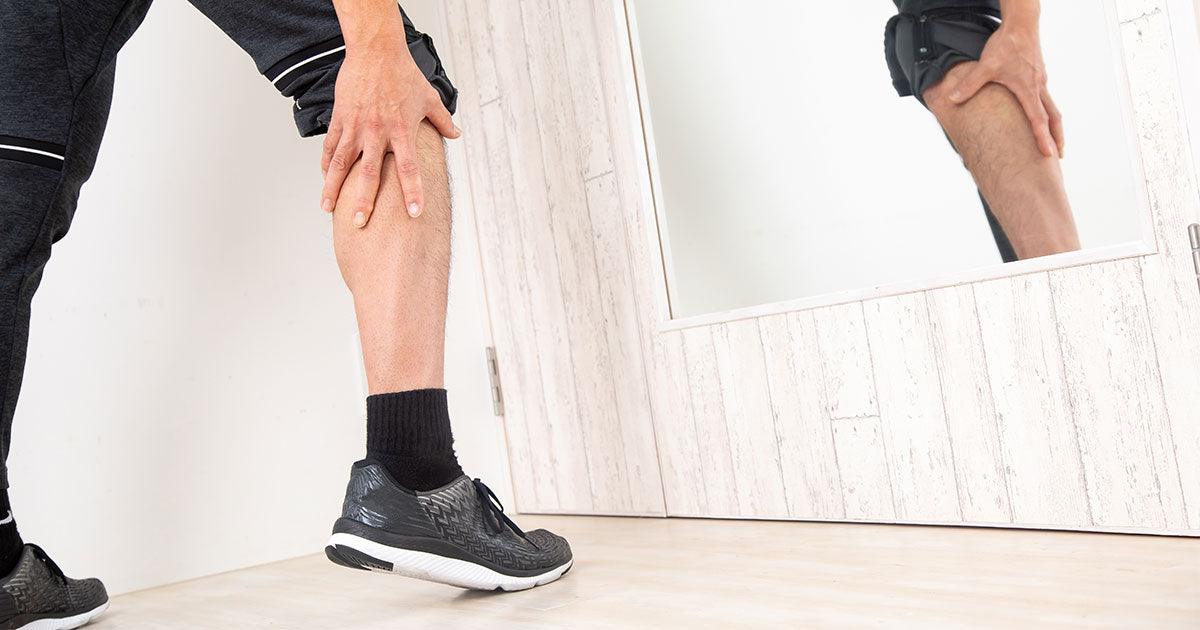 Man looking at mirror calfs