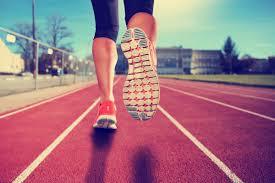 Runner running on track