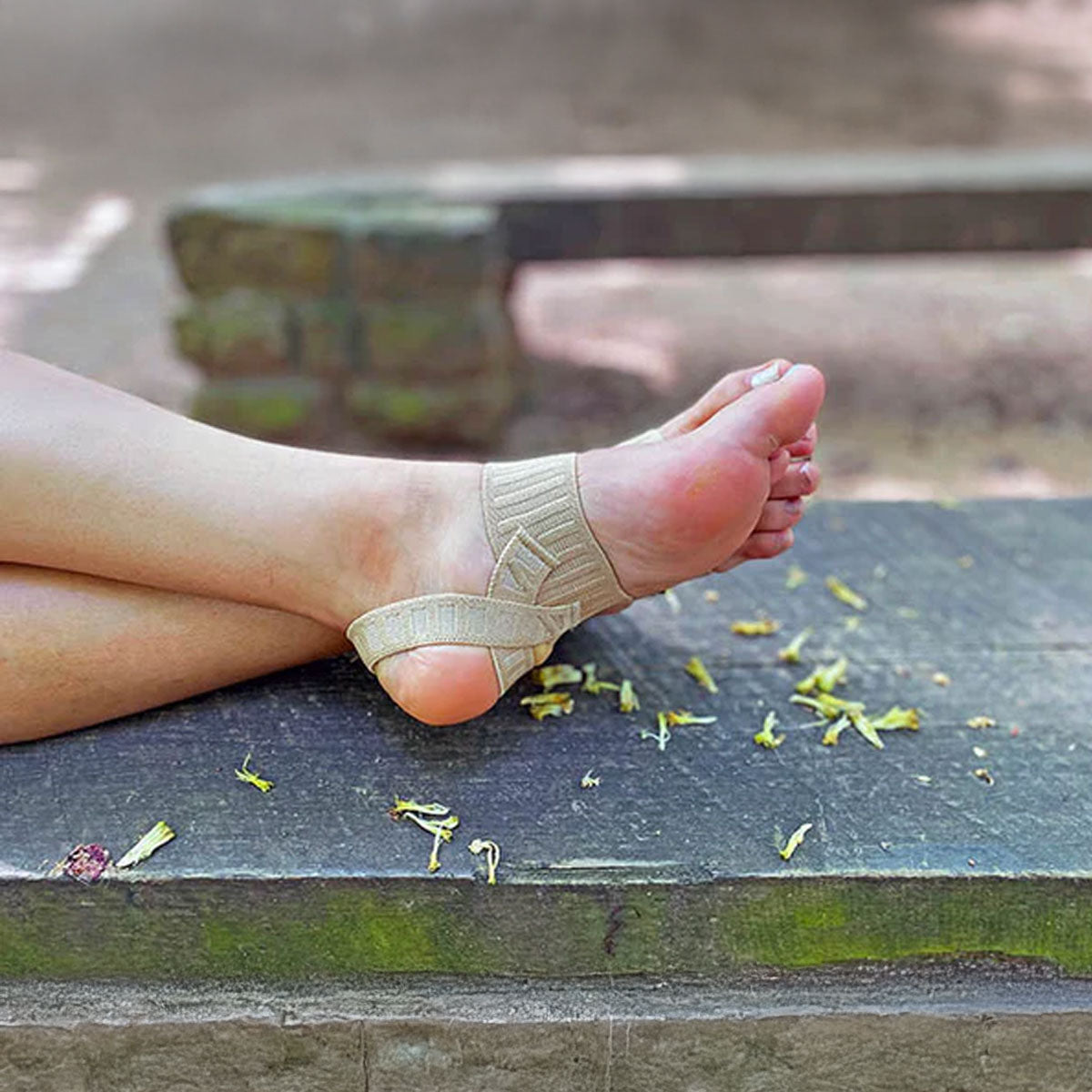 Lady wearing Tuli's Arch Support and Compression Band