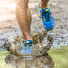 Runner stepping on mud.