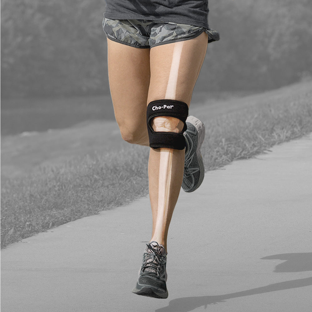 Lady runner wearing the Cho-Pat Dual Action Knee Strap