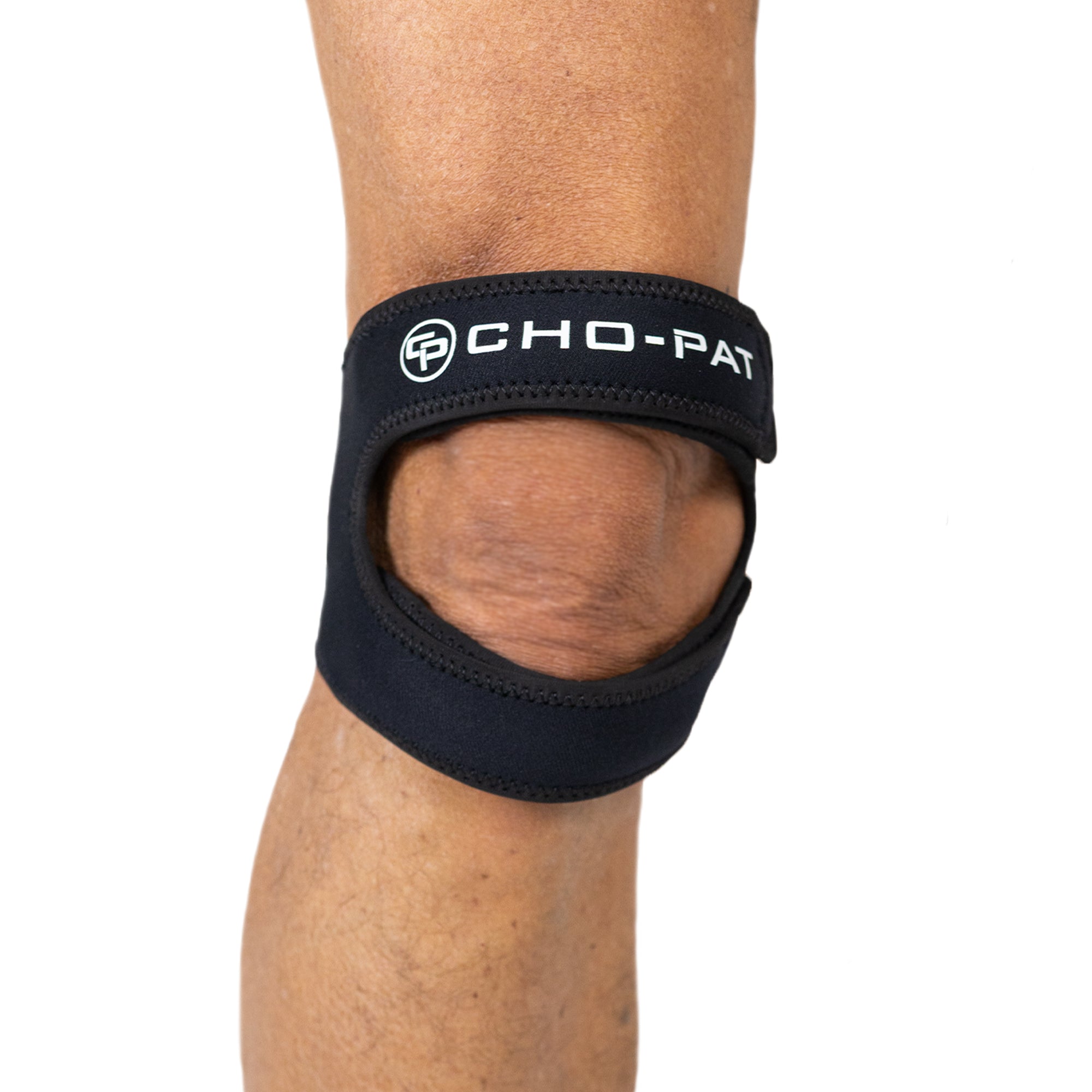 Cho-Pat Dual Action Lite knee strap worn on knee showing dual-support design above and below the kneecap