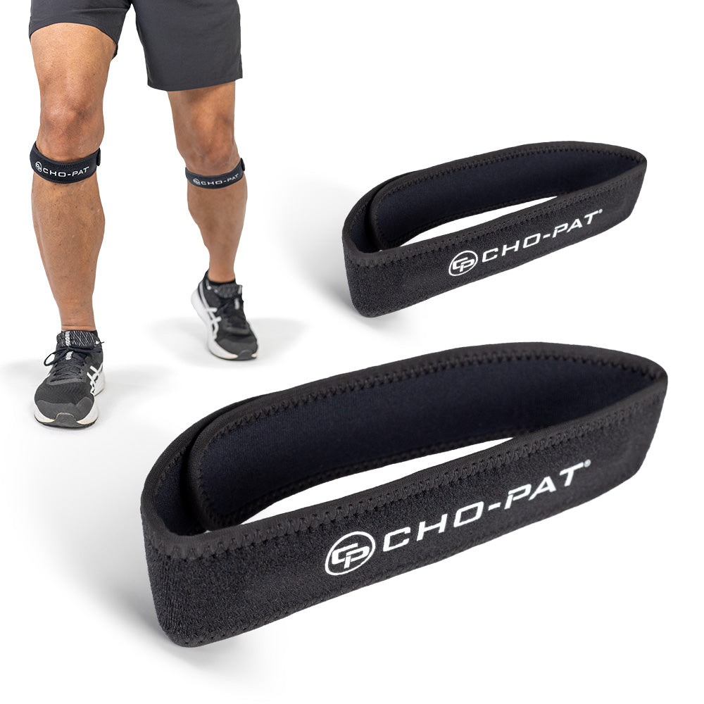 Two black Cho-Pat Patella knee straps shown worn below the knee and two laid flat
