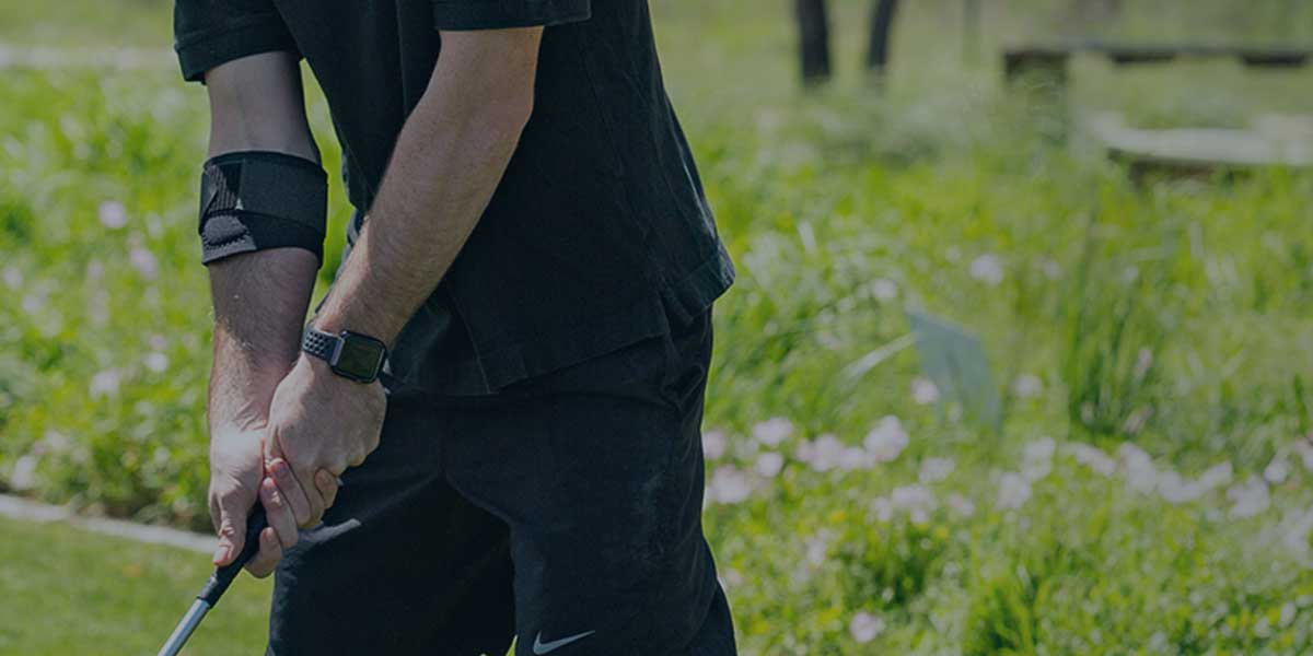 Golfer using the Cho-Pat Golfer's Elbow Strap