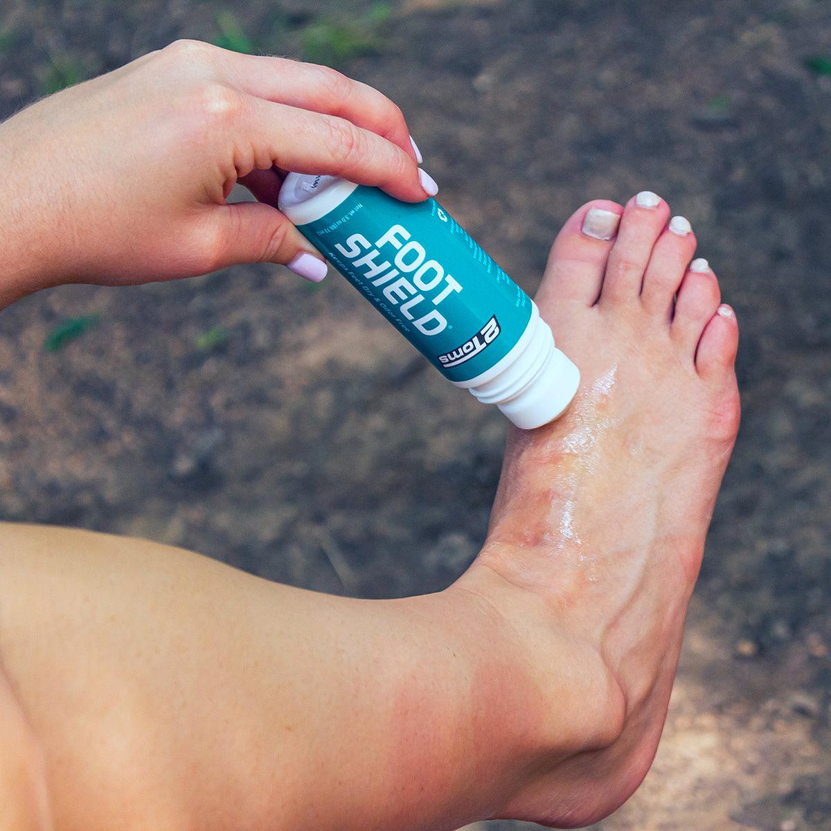 Image of women applying 2Toms FootShield to her foot