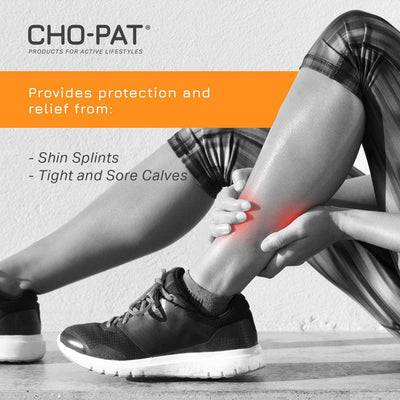 Female runner sitting on the floor suffering from shin splint pain